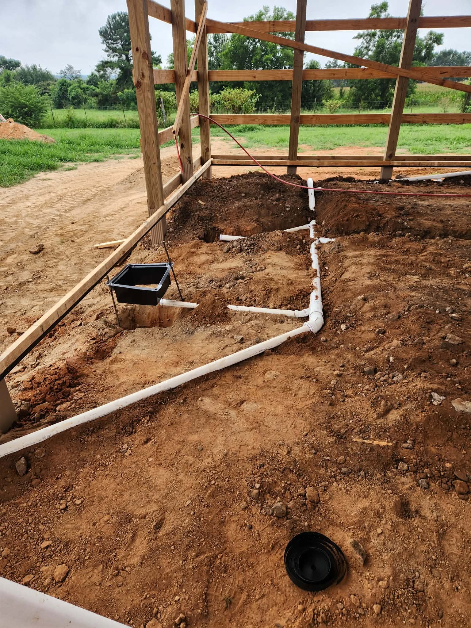Underground drain and water line rough-in for a new pole barn